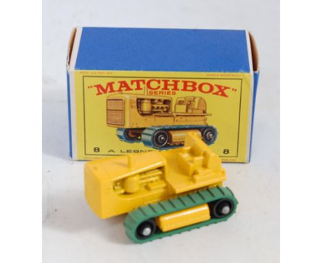 A Matchbox No. 8 Caterpillar tractor, comprising of yellow body with green tracks in the original all-card box (M,BM)