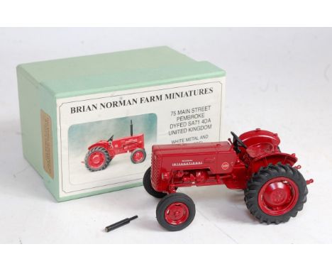 A Brian Norman farm miniatures 1/32 scale white metal and resin model of a McCormick International B250 tractor comprising of