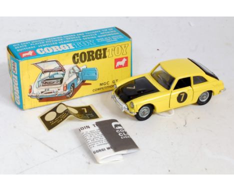 A Corgi Toys No. 345 MGC GT competition model comprising of yellow and black body with wire work hubs, sold in the original b