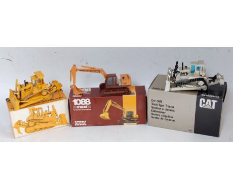 Three various boxed Caterpillar Super Mini and Conrad/NZG 1/50 scale boxed diecasts to include an NZG No. 233 Caterpillar D8N