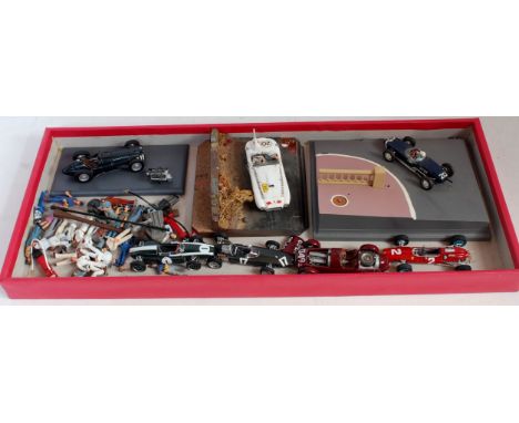 A collection of various white metal and resin kit built and hand built racing saloons together with a quantity of associated 