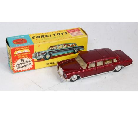 A Corgi Toys No. 247 Mercedes Benz 600 Pullman comprising of metallic maroon body with off-white interior and spun hubs, sold