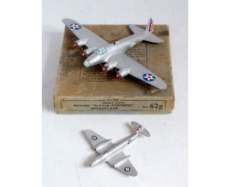 A Dinky Toys No. 62G Boeing Flying Fortress monoplane comprising silver body with four 3-blade red propellers, this example h