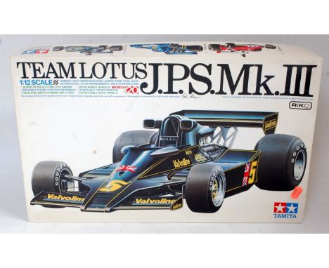 A Kyosho and Tamiya complete and part built plastic kit group, to include a complete Kyosho 1/18 scale Lotus Honda 99T racing