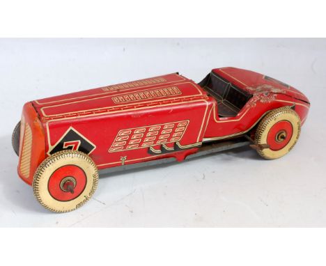 A Wells or Mettoy large scale British made tinplate clockwork racing car comprising of red, cream and black body with Dunlop 