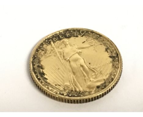 A 22 carat gold American Eagle 1/10 ounce coin