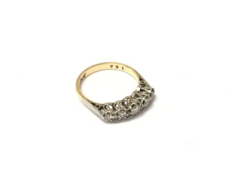 An 18ct gold And platinum five stone set diamond ring, approx weight 2.53 grams.