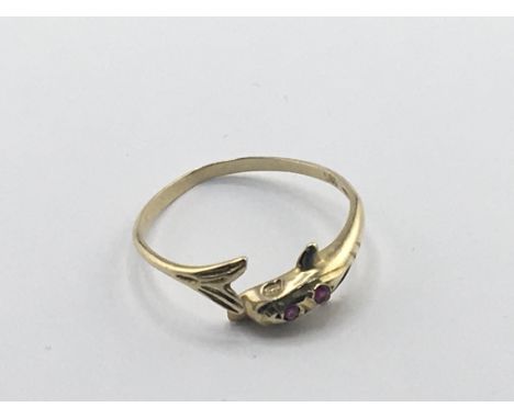 A 14carat gold ring set with ruby and in the form of Dolphins. Weight 1g