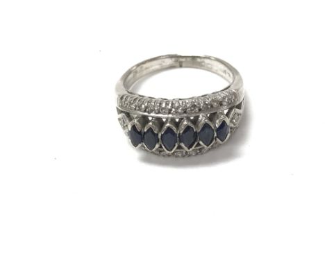 A 9ctbwhite gold ring set with diamonds and sapphires. Size Q and 6.39g Postage A