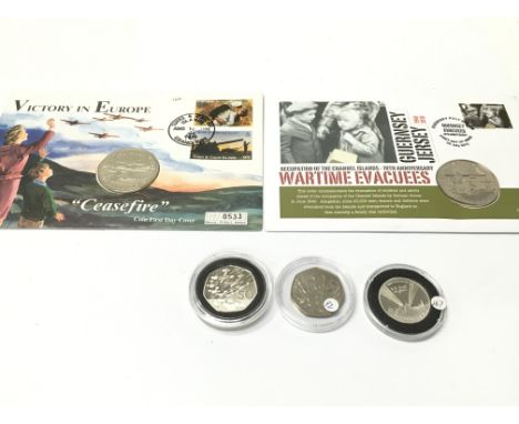 A silver proof 50p and two coin first day covers. Postage A