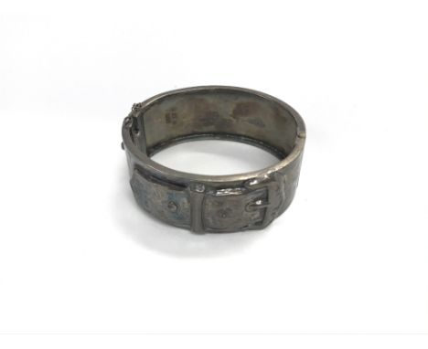 A silver buckle bangle approx weight 36.98grams.