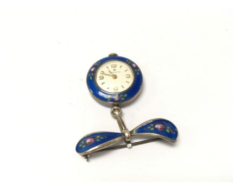 A silver and blue enamel Hamilton nurses watch.