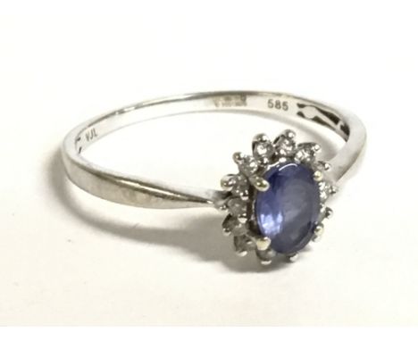 A 9 carat ring set with an aquamarine stone and small diamonds, size U. 2.2g. Postage category A