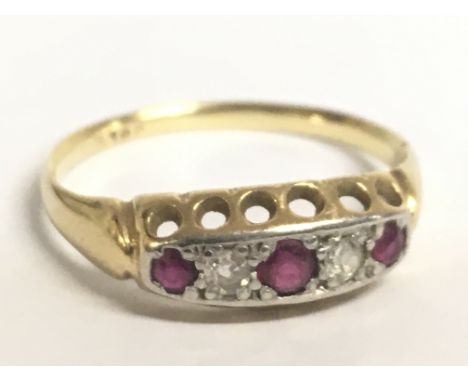 A 9 carat gold ruby and diamond set ring. Size N Postage category A