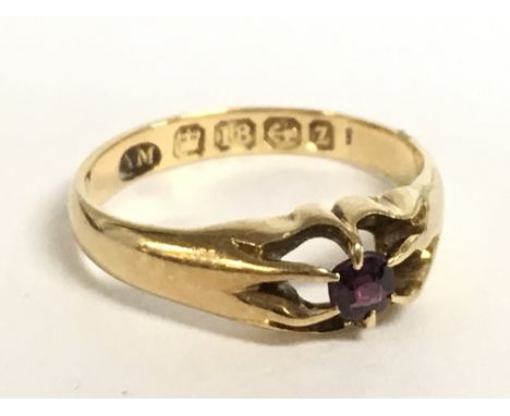 An 18 carat gold ring. 2.8g. size J. Postage category A