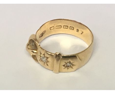 An 18carat gold buckle ring set with two diamonds weight 5.5g