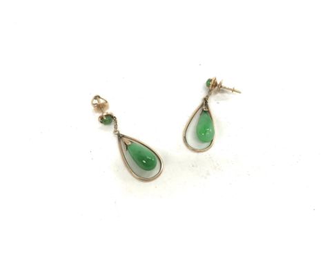 A 14ct gold pair of jade earrings. Approx weight 4.17 grams.