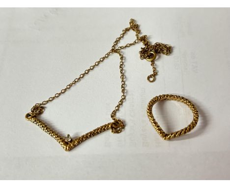 A 9ct gold and diamond wishbone necklace. 3.51g Clasp AF together with a matching 9ct gold wishbone ring