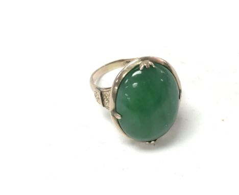 A vintage 9ct gold apple green jade ring. Size N and 7.81g total. Postage B