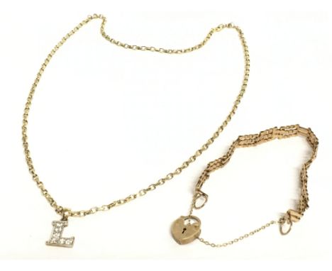 A 9ct gold gate bracelet and a 9ct necklace with 9ct gold L pendant. Total weight 9.5g Postage category A