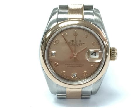 A ladies Rolex Datejust 26mm 179161 with pink mother of pearl dial set with two diamond markers. Rose gold and steel bracelet