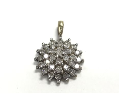 A 9ct gold diamond cluster pendant. Postage category A