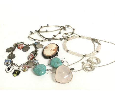 A collection of jewellery including a rose Quartz pendant, silver enamel charm bracelet, cameo etc. Postage category a