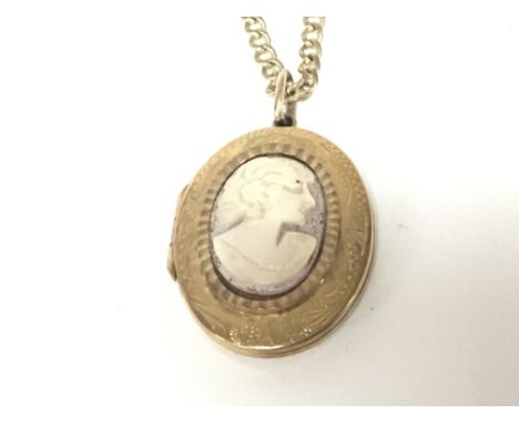 A 9carat gold locket with applied cameo with attached 9carat gold chain weight 13.5g