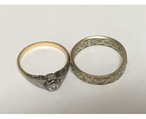 An 18carat gold ring set with a small diamond weight 2g and a gold eternity ring weight 2g. (2)