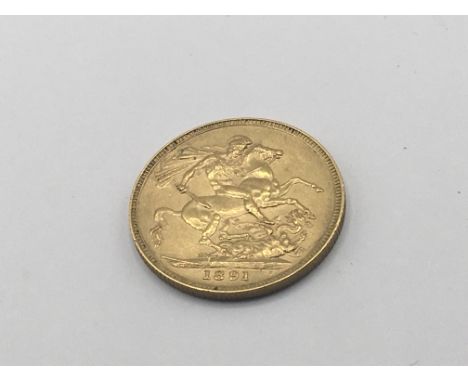 A Victorian gold Sovereign dated 1891.