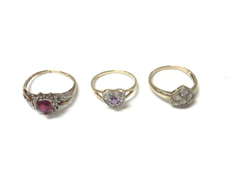 Three 9ct gold rings set with assorted gems.total weight 5.79g. Postage A