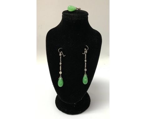 A fine pair of 1930s white gold and diamond and polished apple green jade drop earrings together with an identical pendant 5.