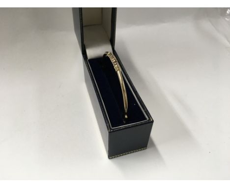 A 9ct gold bangle. Approx weight 4.7 grams.
