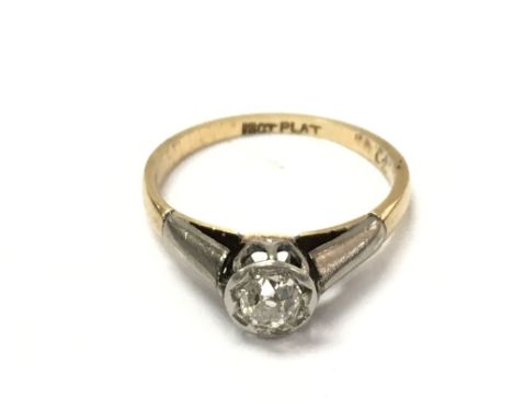 An old cut solitaire diamond set in platinum and 18ct gold ring. Size L 1/2 and 2.55g.Approx 0.30 diamond.
