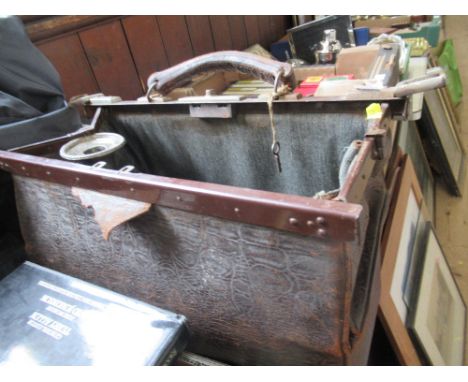 A vintage bag and contents, including Egyptian model, tankards etc