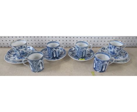 A pair of blue and white onion pattern trio's, together with four coffee cans and two saucers