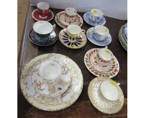 A collection of 19th century and later cups and saucers, including Copeland and Garrett, a pair of cups and saucers decorated