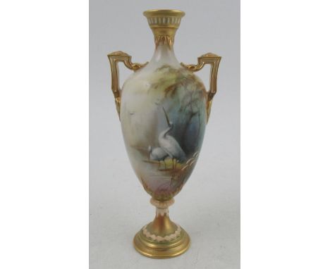 A Royal Worcester pedestal vase, decorated all round with a landscape and stork by Lewis, shape number H247, height 7.5ins