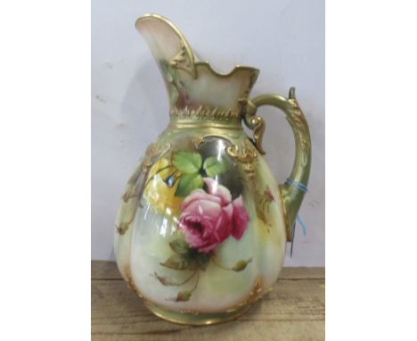 A Royal Worcester Hadley jug, decorated with roses, damage to the handle, height 10ins