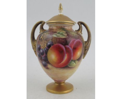 A Royal Worcester covered pedestal vase, decorated to the front with fruit to a mossy background by J Smith, shape number 270