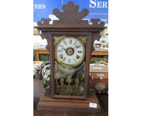 An American style mantel clock, the glazed door decorated with figure and foliage 