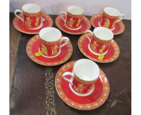 A set of six Wedgwood coffee cans and saucers, decorated with the Musical Muses pattern