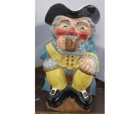 A Clarice Cliff toby jug, of a seated man drinking beer, height 9insCondition Report:  Generally crazed but no damage or rest