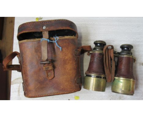 A cased pair of vintage binoculars