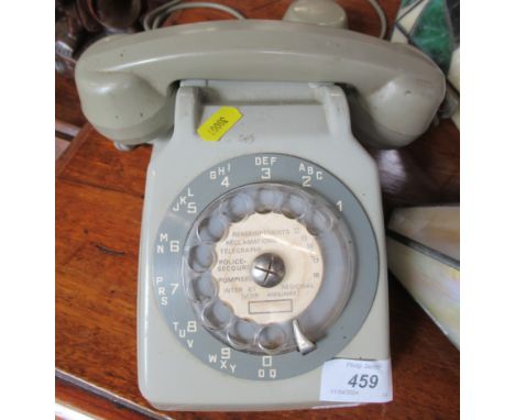 A vintage telephone with "Evesdropper" ear piece&nbsp;