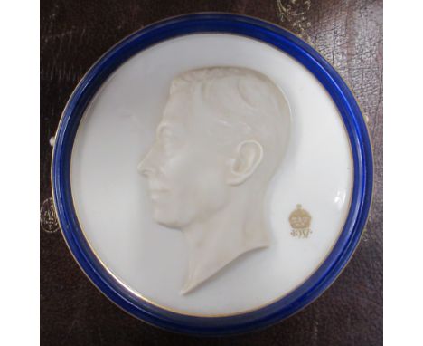 A Royal Worcester circular relief plaque, of King George VI, diameter 6.25ins