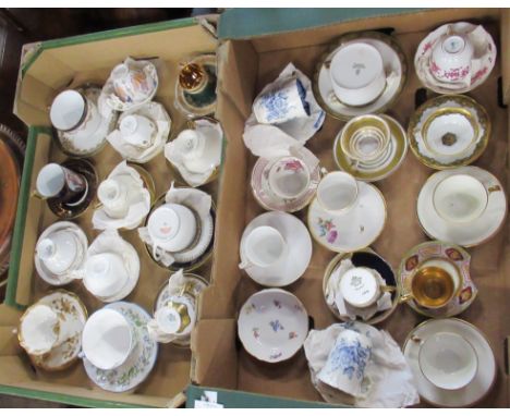 Two boxes of cabinet cups and saucers