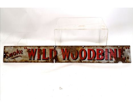 Antique enamel advertising sign Smoke Wild Woodbine 77cm x 10cm. Has obvious losses and corrosion. 