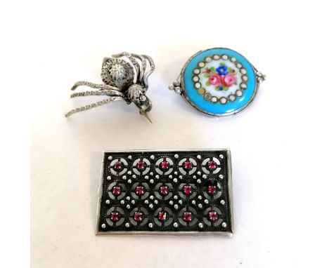 3 unmarked silver brooches, 1 with a floral enamel panel 3.5cm across 