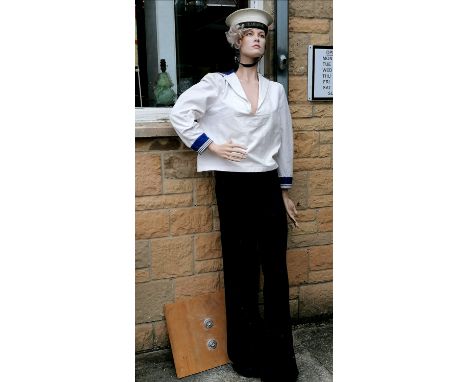 Female shop mannequin dressed in sailor suit 